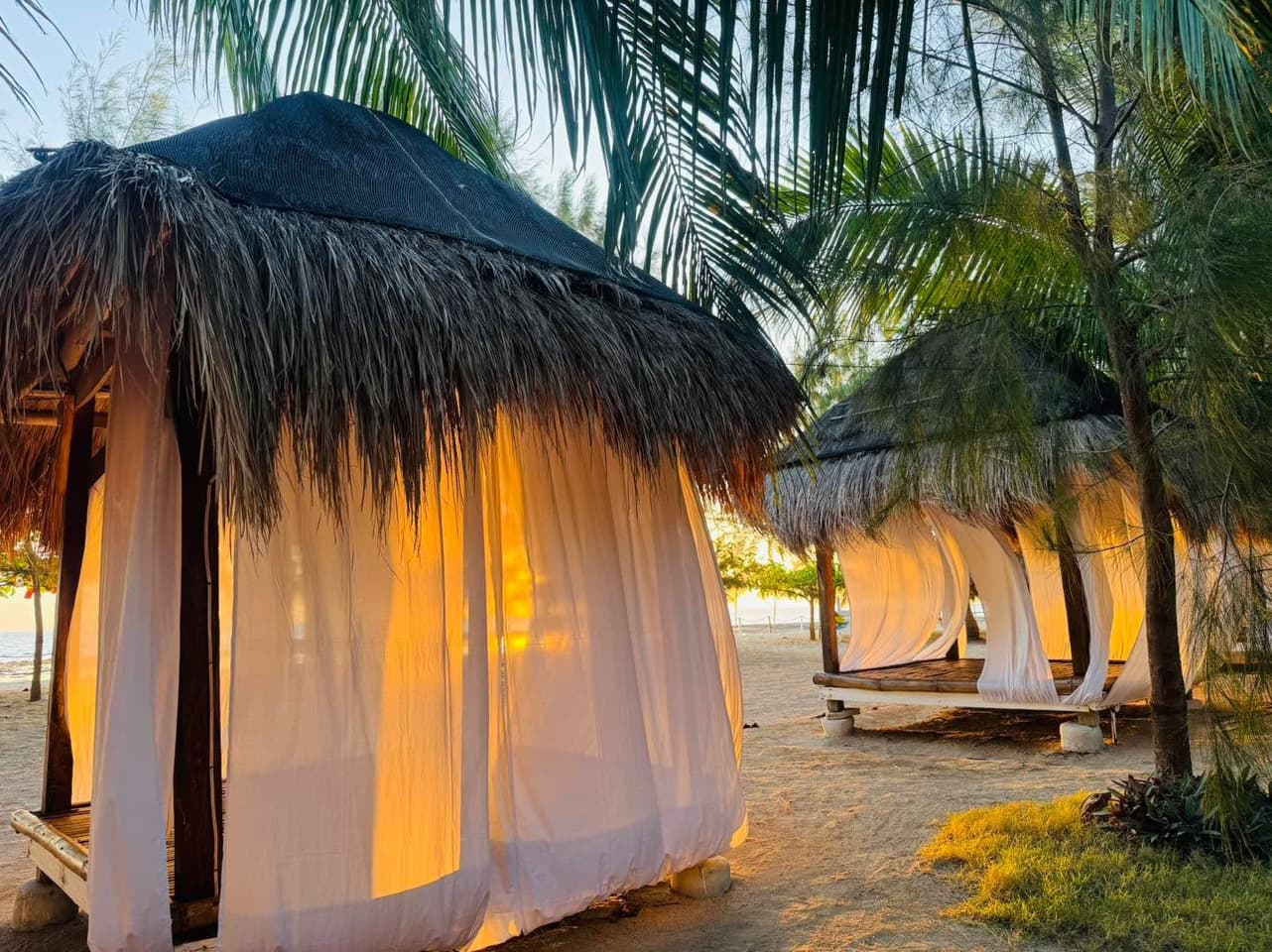 Open cabana with its side panels drawn closed for the evening