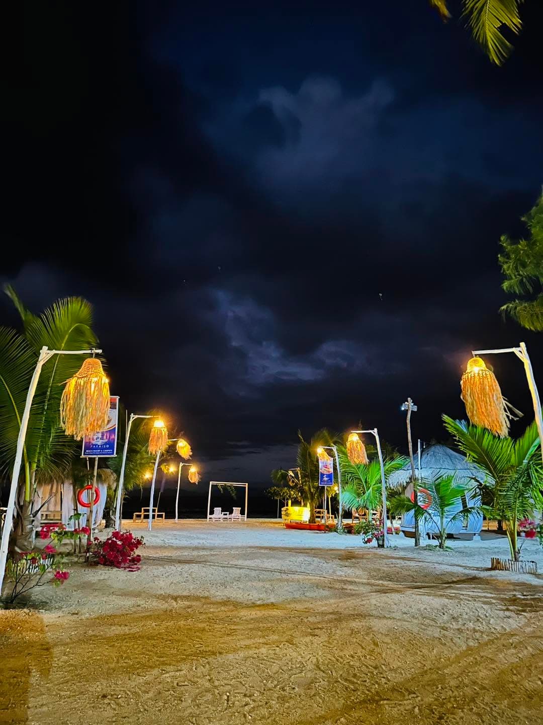 Guests gathered by the shore at Paraiso