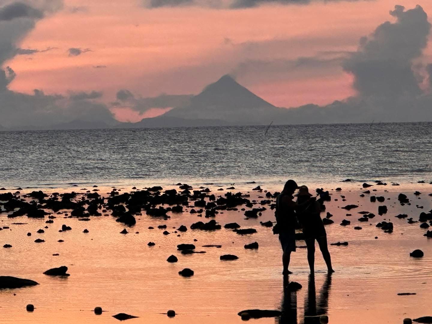 Mount Mayon visible across the water at dawn