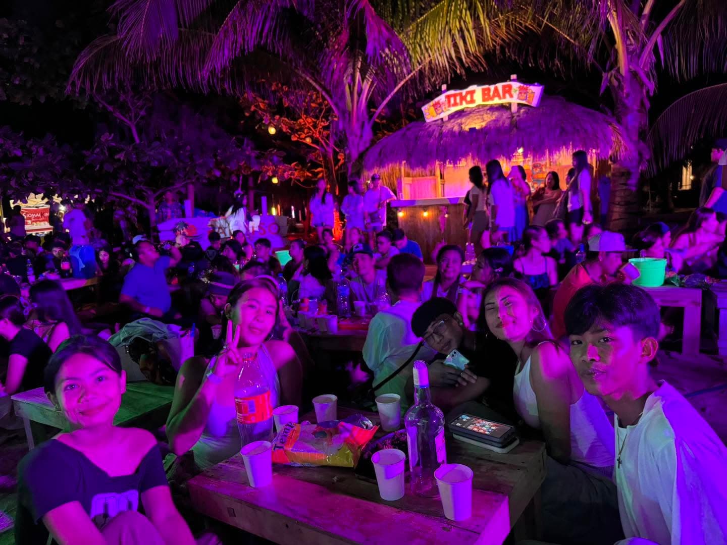 Guests dancing at the Saturday night beach party