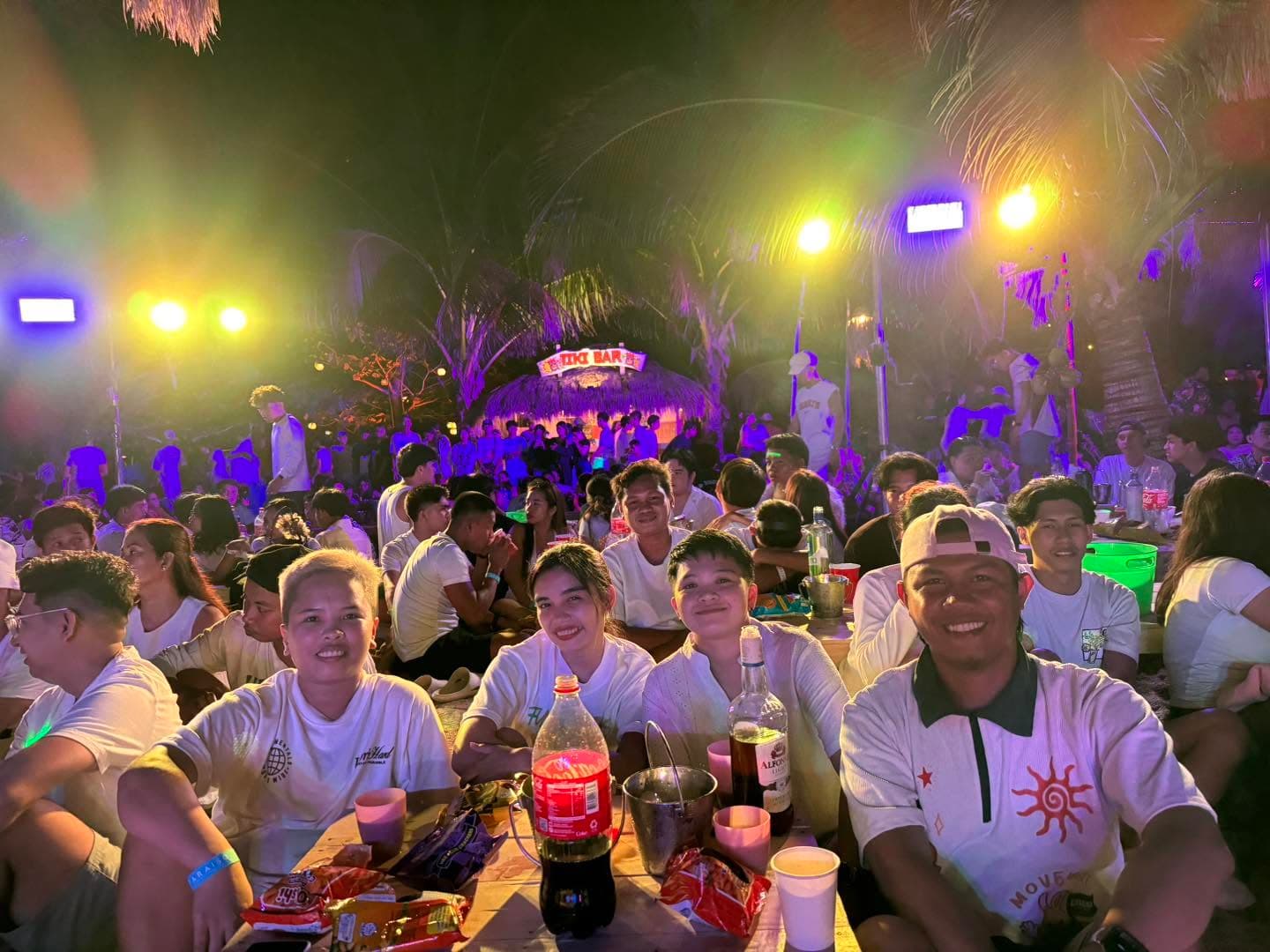 The beach party area lit up after dark